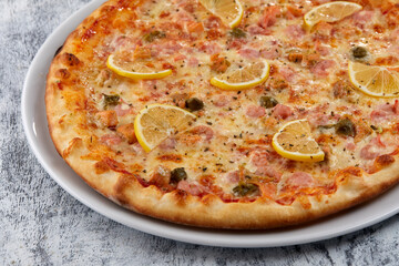 fresh pizza on the white plate