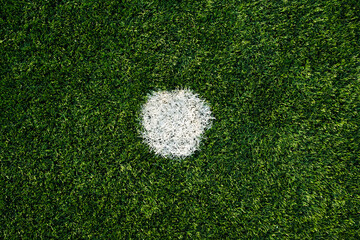 Close up shot of a penalty spot in football pitch