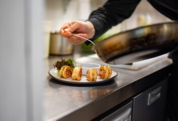 man chef cooking fried shrimp on kitchen
