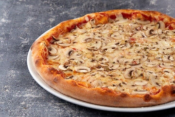 fresh pizza on the white plate