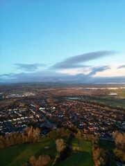 Aerial view of residential neighbourhoods surrounded by green space and countryside. Taken in Bury Lancashire England. 
