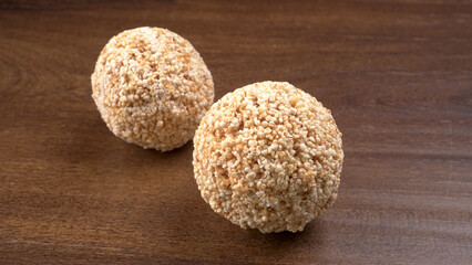 Amarnath seed, Cholai or Rajgira laddo, Also in cube shape called chikki or cake form, Indian sweet and healthy food served in a plate and bowl. Selective focus.