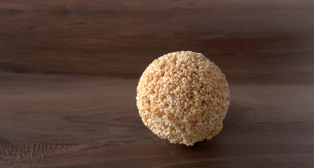 Amarnath seed, Cholai or Rajgira laddo, Also in cube shape called chikki or cake form, Indian sweet and healthy food served in a plate and bowl. Selective focus.