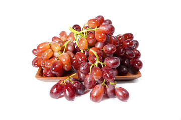 bunch of red seedless grapes on a white background
