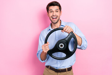 Fototapeta na wymiar Photo of funny crazy man hold steering wheel drive new own car education courses isolated on pink color background