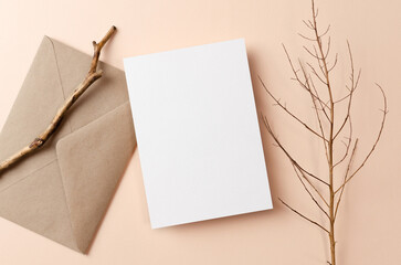 Greeting card or invitation mockup with envelope and natural twigs decorations