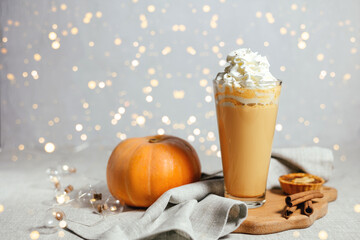 Pumpkin spicy latte on a gray background.