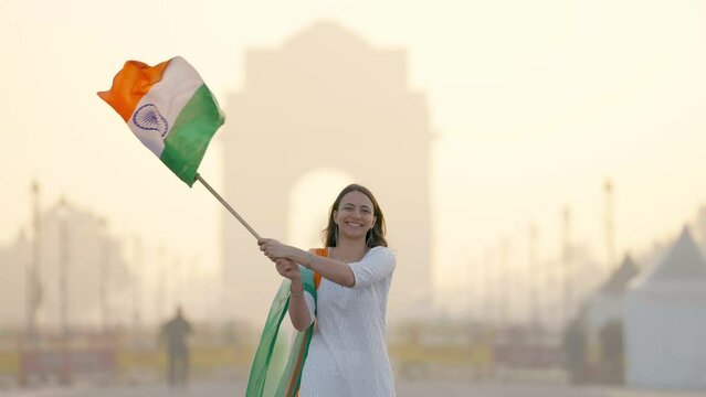 Indian girl hoisting Indian flag