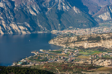 Aerial view of Lake Garda with the small towns of Riva del Garda and Torbole, the Sarca river and Alps view from the mountain range of Monte Baldo. Trento province, Trentino Alto Adige, Italy, Europe.