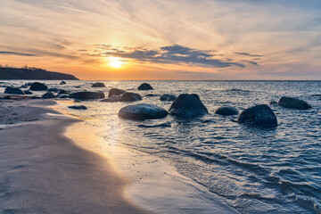 sunset on the beach of the island of ruegen in the baltic sea