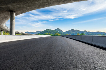 Asphalt road and Bridge with mountain backgrounds