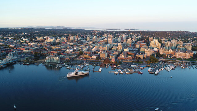High angle view of cityscape by sea against sky