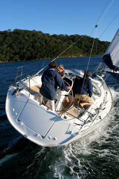 Trimming The Sails On A Yacht Cruising On The North Shore From Sydney, Australia.