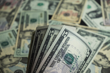 Banknotes of 5 US dollars, Stacks of money from a banknote of 5 dollars, top view.
five dollar bill Abraham Lincoln