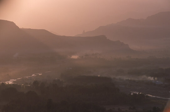 The Bamiyan river glows in dawn light in the Bamiyan Valley