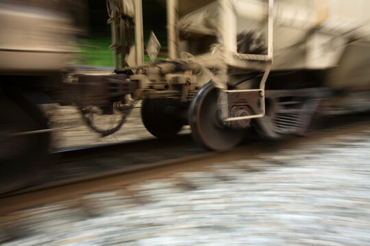 A heavily laden coal trian speeds along the tracks at the bottom of the New River Gorge near Fayetteville, WV