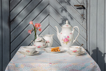 An old crockery on a garden table.