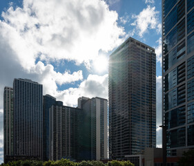Detail of the skyscrapers of the city of Chicago backlit with the sun between the clouds