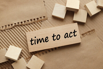 time to act etext on wooden background on brown background