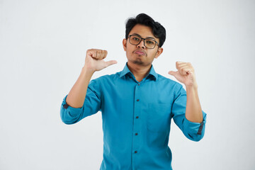 Fototapeta premium Asian Businessman with glasses wearing blue shirt point finger at himself posing confident isolated on white background