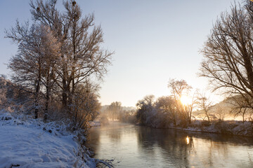 river landscape in winter at sundown
