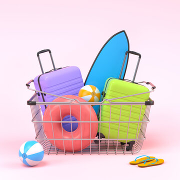 Colorful luggage with beach accessories in shopping basket on pink background.