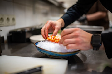 chef cooking crab legs on kitchen