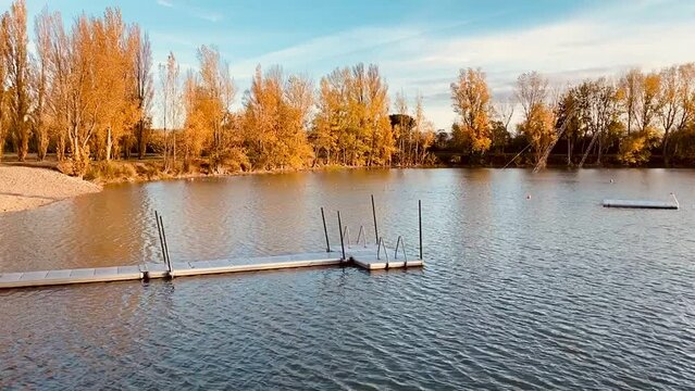 View of Lake Buzerens, Bram, France.  Wooden pier on a sunny day.