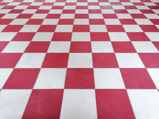 Red and white tiled floor symmetrical with grid texture in perspective view for...