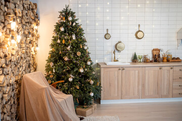 New Year's kitchen interior with a Christmas tree and a rocking chair