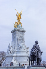 Fototapeta na wymiar Bronze statues around the Queen Victoria Memorial