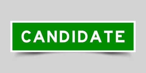 Green color square label sticker with word candidate on gray background
