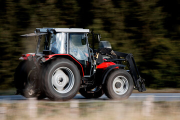a modern tractor speeding in the countryside © Tobias Arhelger