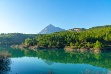 Naklejka na ściany i meble Scenic view of Doyran lake with reflection of mountains 