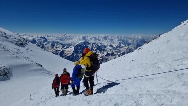 Climbers of the highest mountain in Europe, Elbrus, descend after successfully conquering the summit