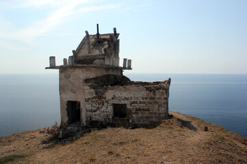 An old lighthouse on cape Meganom in in Crimea, Ukraine
