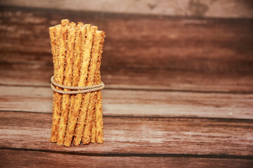 Long dry baked bread sesame sticks.