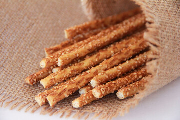 Long dry baked bread sesame sticks.