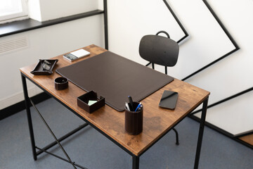 desktop space in the office with leather stationery accessories and brown color bevar