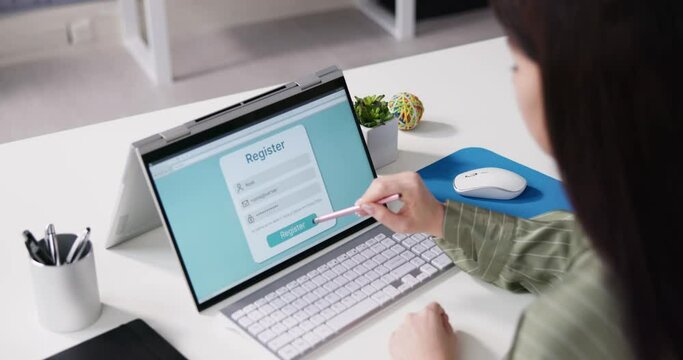 Businesswoman's Hand Filing Online Registration Form