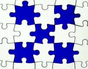 Missing jigsaw puzzle on blue background with customizable space for text or ideas. Copy space