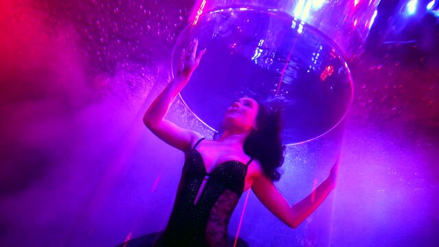 graceful beautiful lady in black lingerie or swimsuit swimming underwater, slow motion shot