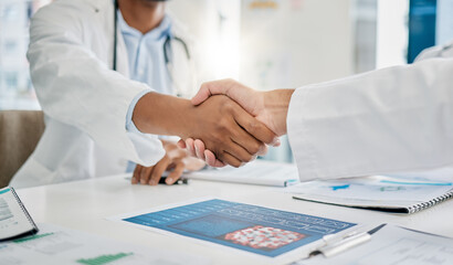 Closeup handshake, doctors and agreement for documents, research or health in hospital to stop...