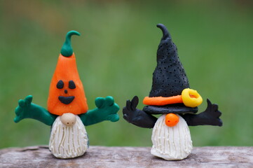 Figures of dwarfs decorated for Halloween. Funny toys.