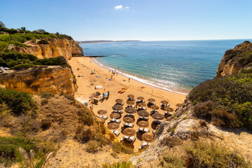 Amazing beach, in the village of Armação de Perâ, during a magnificent summer day, Algarve, Portugal