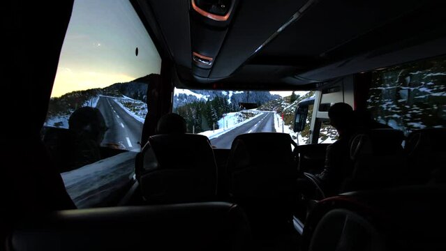 Silhouettes Of Unknown People Riding The Bus In The Swiss Alps