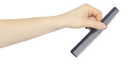 comb in hand isolated from background, concept of handing over or throwing away comb, hair problem