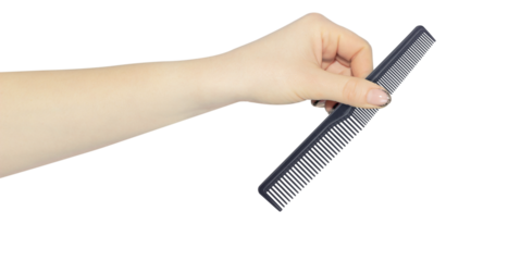 comb in hand isolated from background, concept of handing over or throwing away comb, hair problem