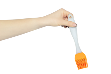 silicone brush in hand, kitchen brush isolated from background