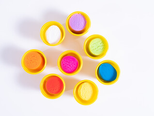 Colourful plasticine for modeling on a white background